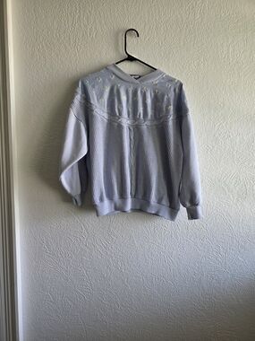 Casio Granycore pastel blue sweatshirt with embroidered floral accents